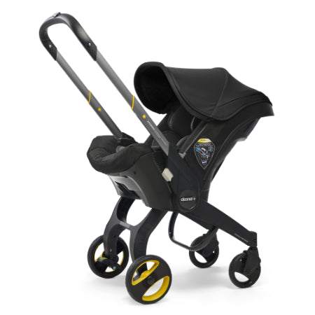 Doona - Coche con asiento de auto negro