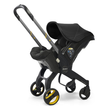 Doona - Coche con asiento de auto negro